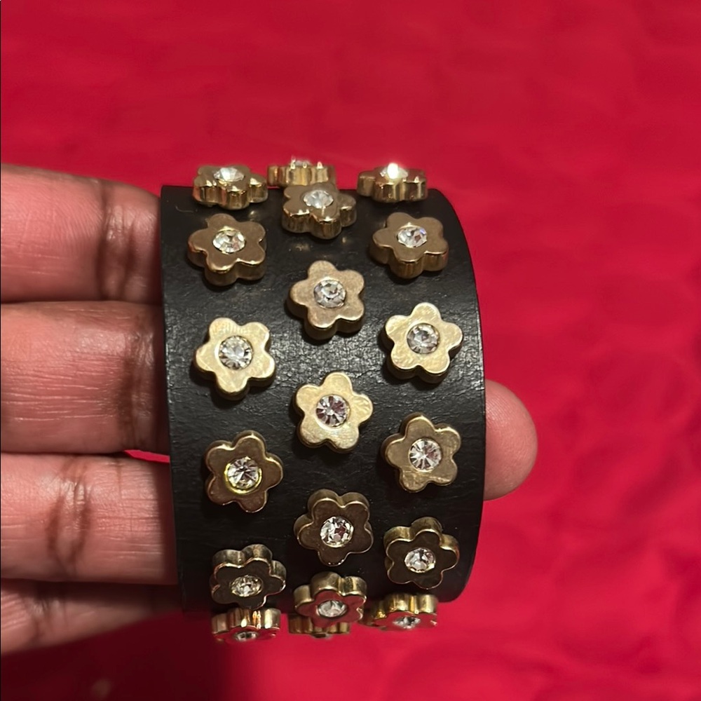 Gold and Black Statement Bracelet with Floral Accents